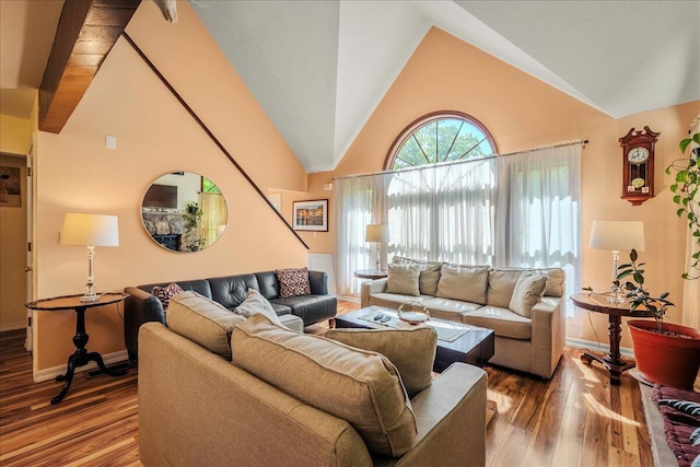 349 Mallard Ln, Bushkill, PA 18324 - living area featuring wood finished floors, baseboards, and high vaulted ceiling