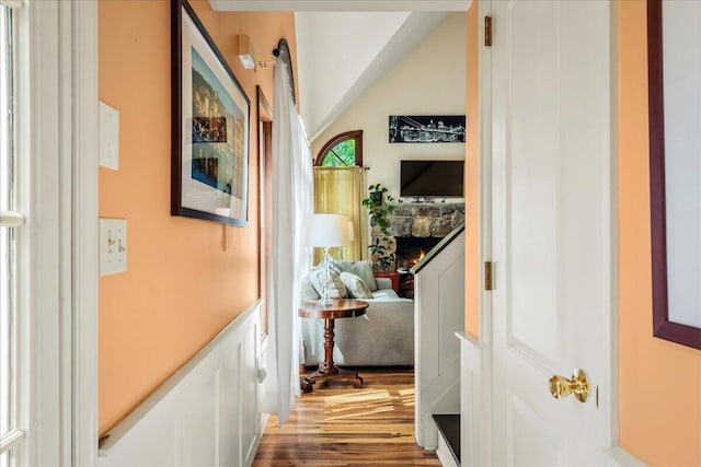 349 Mallard Ln, Bushkill, PA 18324 - corridor featuring wood finished floors, vaulted ceiling, and a wainscoted wall