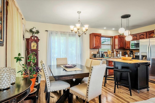 349 Mallard Ln, Bushkill, PA 18324 - dining area featuring a chandelier and light wood-type flooring