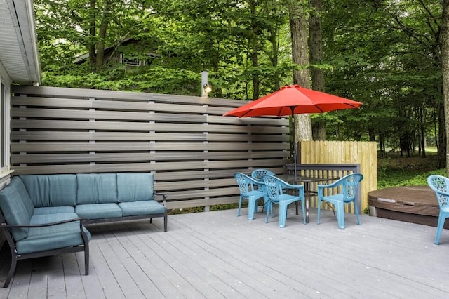 wooden terrace featuring an outdoor hangout area