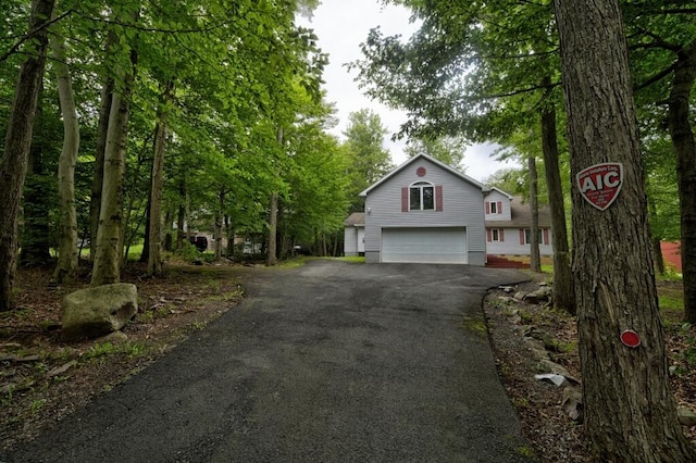 view of front of home with driveway and an attached garage