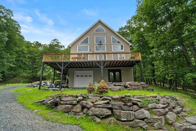 325 Chestnut Rd, East Stroudsburg, PA 18302 - rear view of property with a garage and a deck