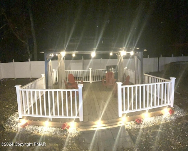 exterior space featuring a deck and fence