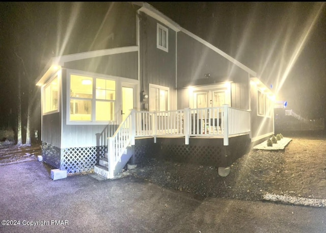 back of house featuring a porch