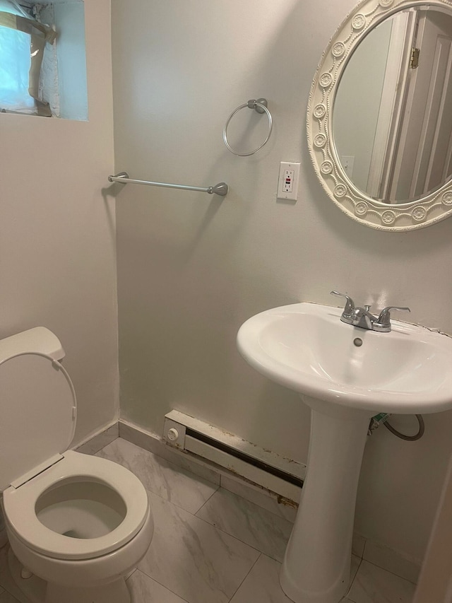 5112 Navajo Pl, Tobyhanna, PA 18466 - half bathroom featuring marble look tile flooring and a baseboard heating unit