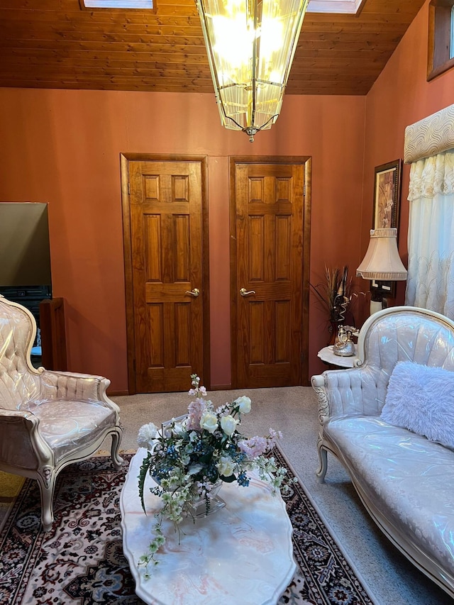 5112 Navajo Pl, Tobyhanna, PA 18466 - living area featuring wooden ceiling, a chandelier, carpet, and a skylight