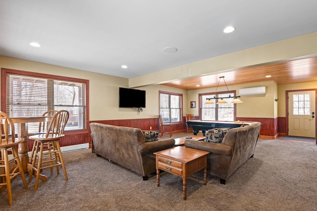 living room with billiards, carpet, a wainscoted wall, and a wall mounted AC