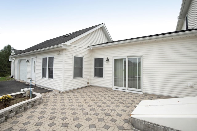 back of house with a patio area