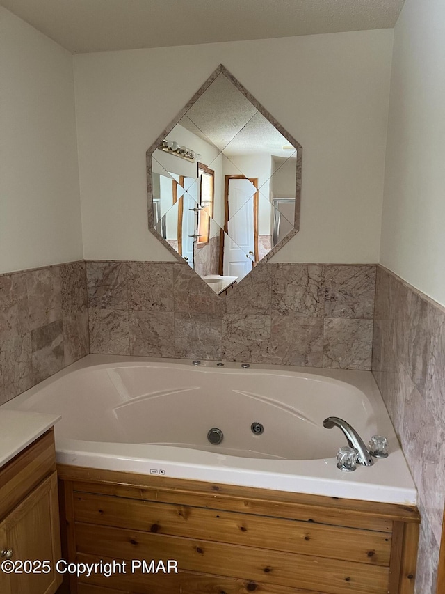 bathroom featuring vanity and a bathtub