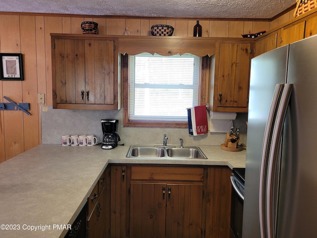 21 Cherry Ct, Clifton Township, PA 18424 - kitchen with freestanding refrigerator, electric range, light countertops, a sink, and brown cabinets