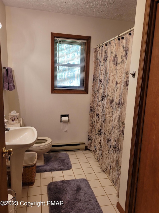 21 Cherry Ct, Clifton Township, PA 18424 - full bath with toilet, a baseboard heating unit, tile patterned floors, a textured ceiling, and curtained shower