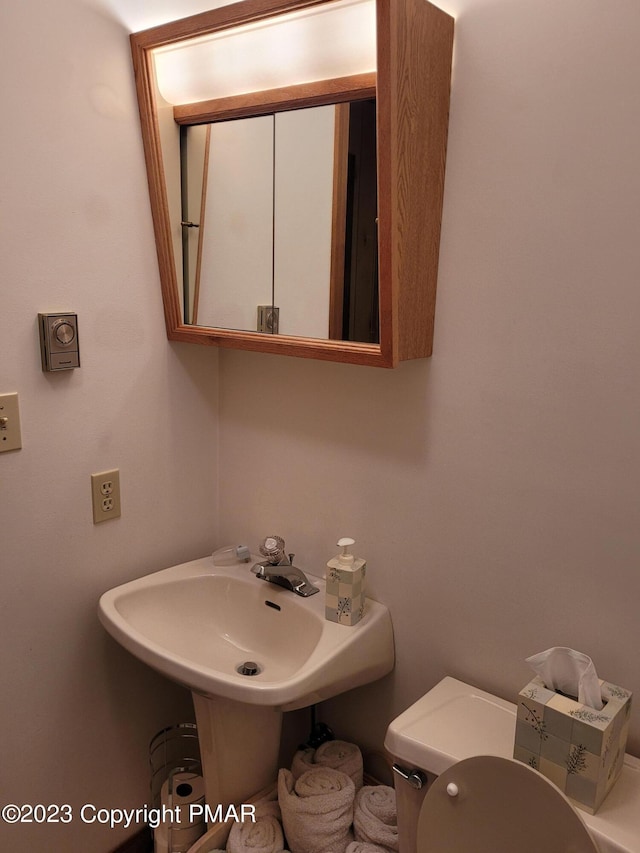 21 Cherry Ct, Clifton Township, PA 18424 - bathroom featuring toilet and a sink