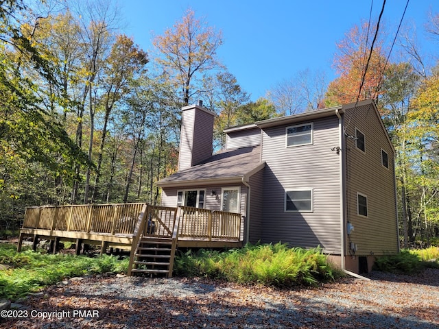 21 Cherry Ct, Clifton Township, PA 18424 - back of house featuring a deck and a chimney