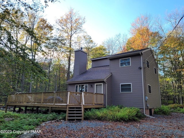 21 Cherry Ct, Clifton Township, PA 18424 - rear view of house featuring a chimney and a wooden deck