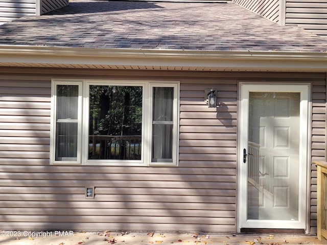 21 Cherry Ct, Clifton Township, PA 18424 - doorway to property featuring roof with shingles