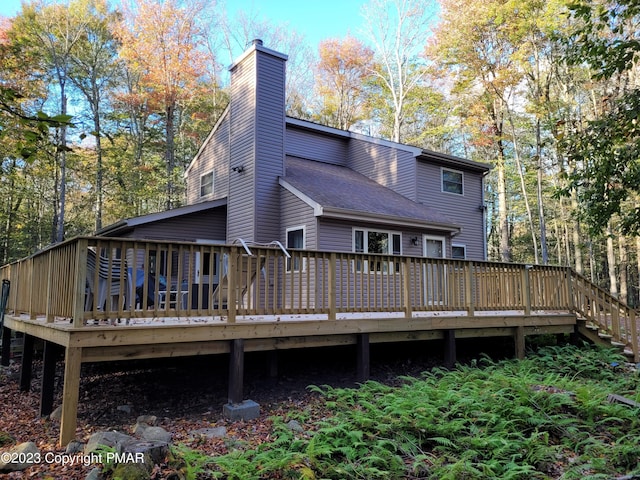 21 Cherry Ct, Clifton Township, PA 18424 - back of property with a chimney and a deck