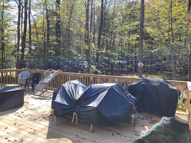 21 Cherry Ct, Clifton Township, PA 18424 - wooden deck with area for grilling and a view of trees