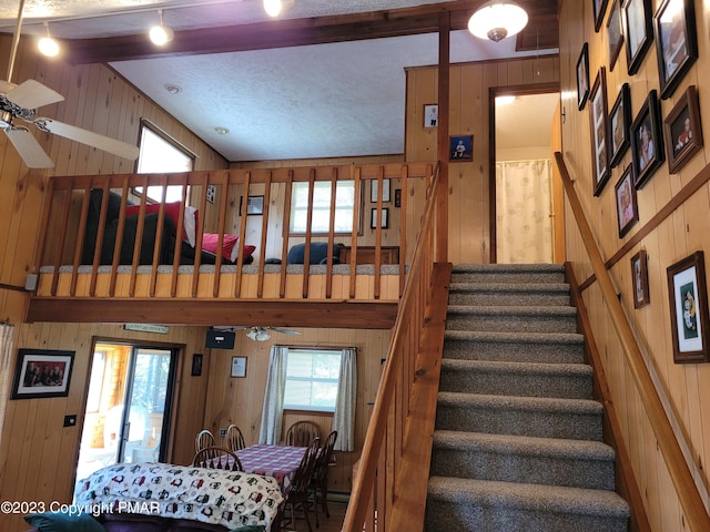 21 Cherry Ct, Clifton Township, PA 18424 - stairway featuring wooden walls, a ceiling fan, and beam ceiling
