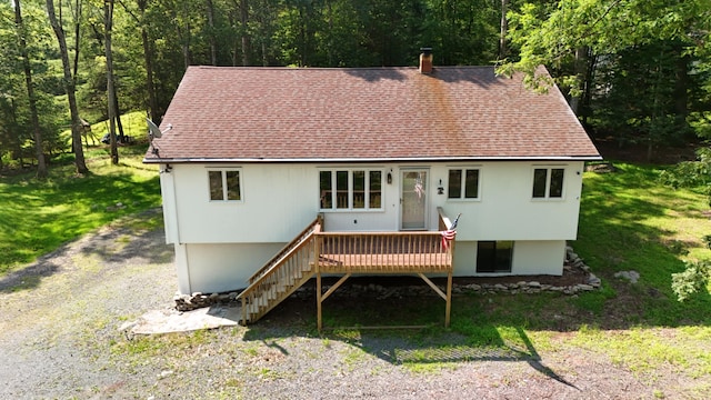 371 Ridge Cir, Cresco, PA 18326 - view of front facade with a shingled roof, a deck, stairs, and a view of trees