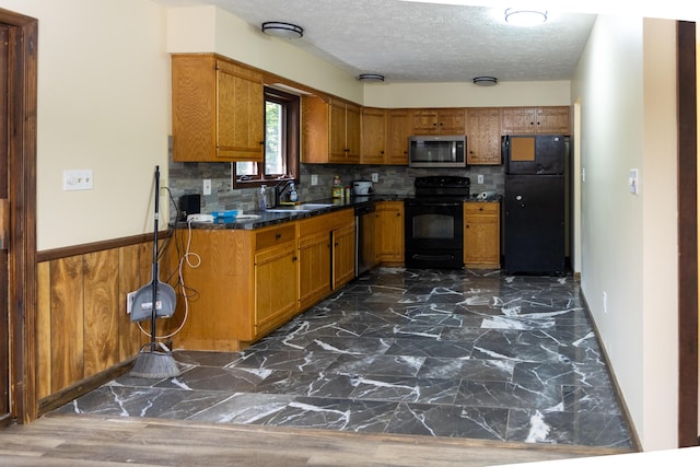 371 Ridge Cir, Cresco, PA 18326 - kitchen with black appliances, brown cabinets, dark countertops, a textured ceiling, and tasteful backsplash