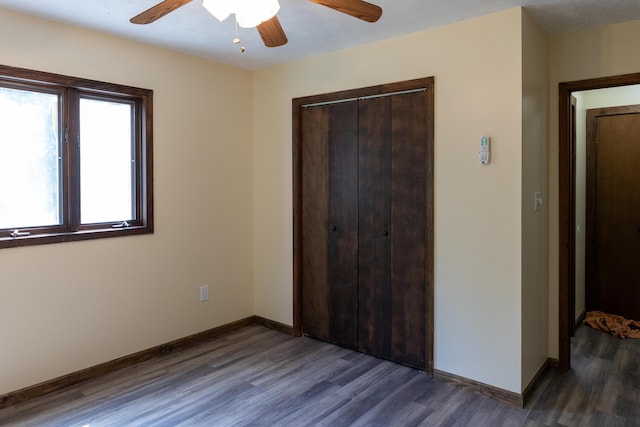 371 Ridge Cir, Cresco, PA 18326 - unfurnished bedroom featuring a closet, dark wood-style floors, and a ceiling fan