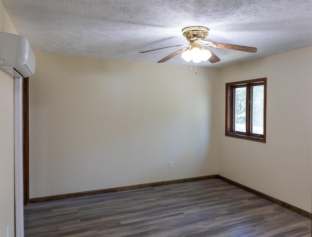 371 Ridge Cir, Cresco, PA 18326 - spare room featuring a wall mounted air conditioner, dark wood-style floors, a textured ceiling, and a ceiling fan