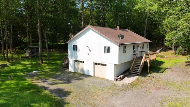 371 Ridge Cir, Cresco, PA 18326 - view of front facade featuring stairs, gravel driveway, a front lawn, a wooden deck, and a shingled roof