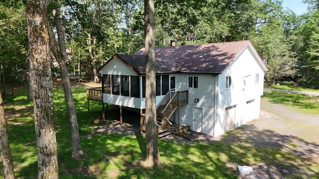 371 Ridge Cir, Cresco, PA 18326 - view of front of property featuring a sunroom, a shingled roof, a chimney, a front lawn, and stairway