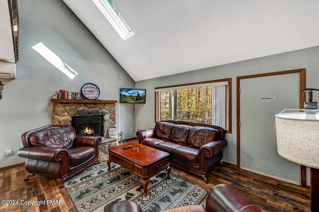 living area with a skylight, a fireplace, high vaulted ceiling, and wood finished floors