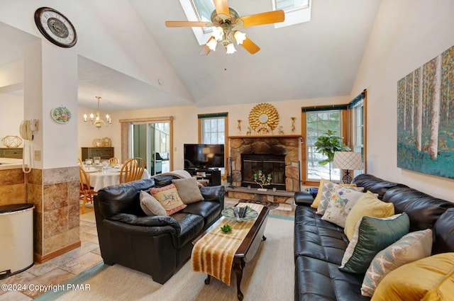482 Spruce Dr, Tannersville, PA 18372 - living area with a stone fireplace, ceiling fan with notable chandelier, and high vaulted ceiling