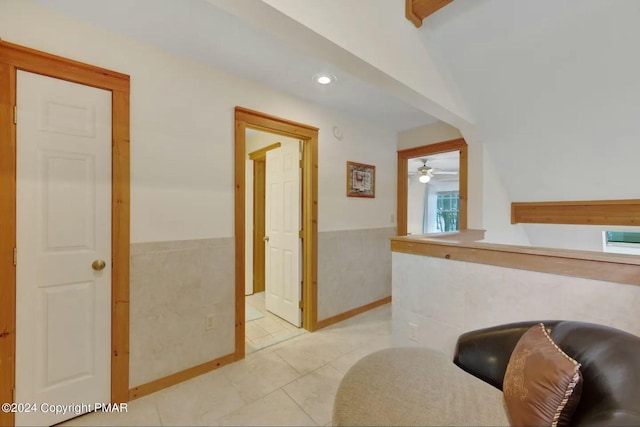 482 Spruce Dr, Tannersville, PA 18372 - interior space with tile patterned floors, a wainscoted wall, tile walls, and a ceiling fan