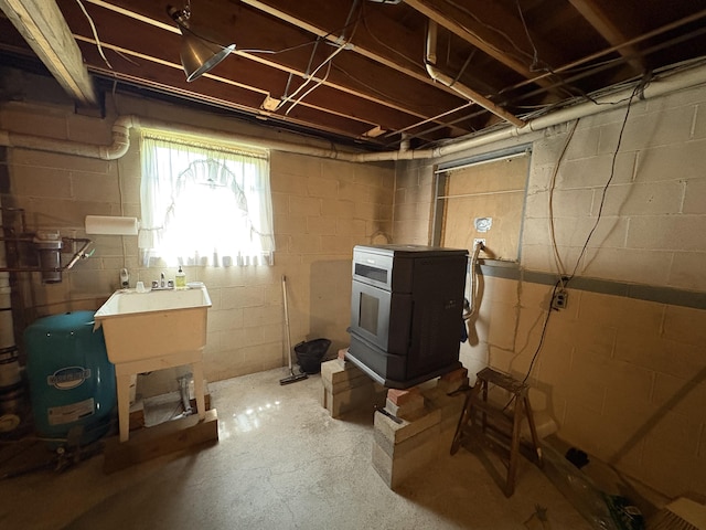 268 Shawnee Dr, East Stroudsburg, PA 18302 - below grade area featuring a water pressure tank and a wood stove