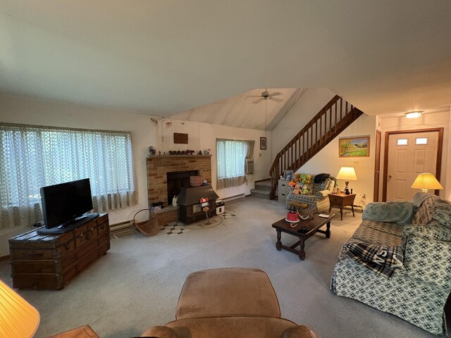 268 Shawnee Dr, East Stroudsburg, PA 18302 - carpeted living room with stairs, a ceiling fan, vaulted ceiling, and a baseboard heating unit