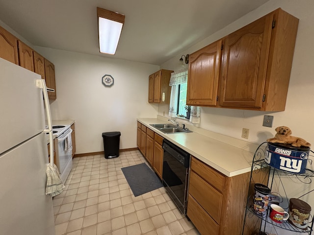 268 Shawnee Dr, East Stroudsburg, PA 18302 - kitchen with white appliances, light countertops, and brown cabinetry