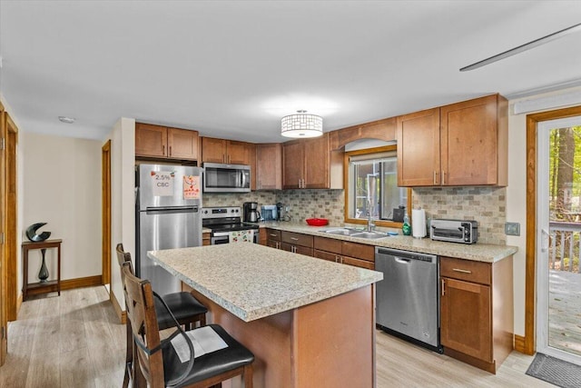 206 Maxatawny Dr, Pocono Lake, PA 18347 - kitchen with appliances with stainless steel finishes, light wood-style flooring, and backsplash