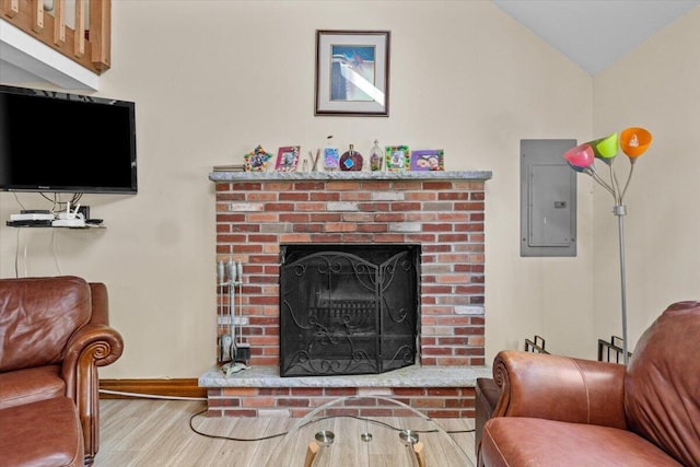 206 Maxatawny Dr, Pocono Lake, PA 18347 - living room with electric panel, wood finished floors, a fireplace, baseboards, and vaulted ceiling