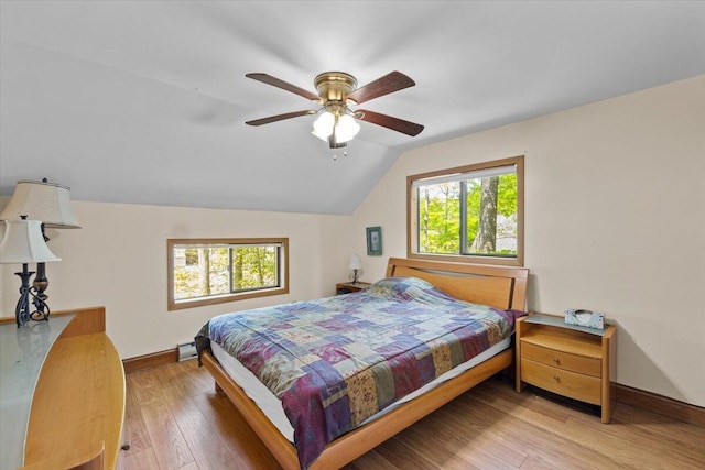 206 Maxatawny Dr, Pocono Lake, PA 18347 - bedroom featuring baseboards, lofted ceiling, wood finished floors, ceiling fan, and baseboard heating