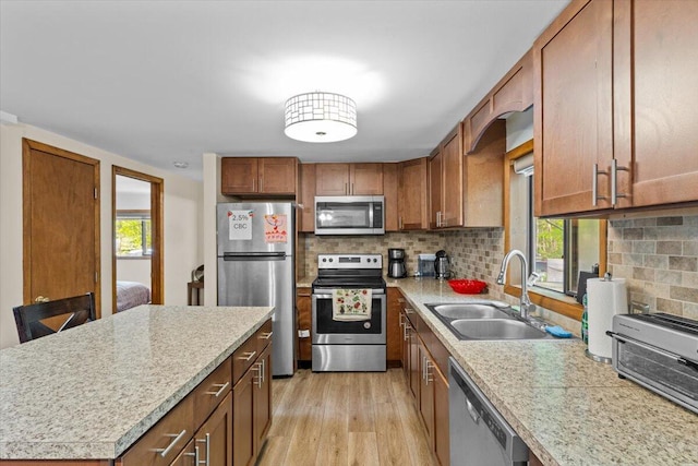 206 Maxatawny Dr, Pocono Lake, PA 18347 - kitchen with appliances with stainless steel finishes, a sink, light countertops, and brown cabinetry