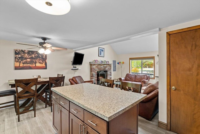 206 Maxatawny Dr, Pocono Lake, PA 18347 - kitchen featuring light wood-style flooring, light countertops, ceiling fan, open floor plan, and lofted ceiling