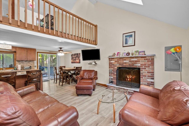 206 Maxatawny Dr, Pocono Lake, PA 18347 - living room with high vaulted ceiling, light wood-type flooring, a fireplace, and ceiling fan