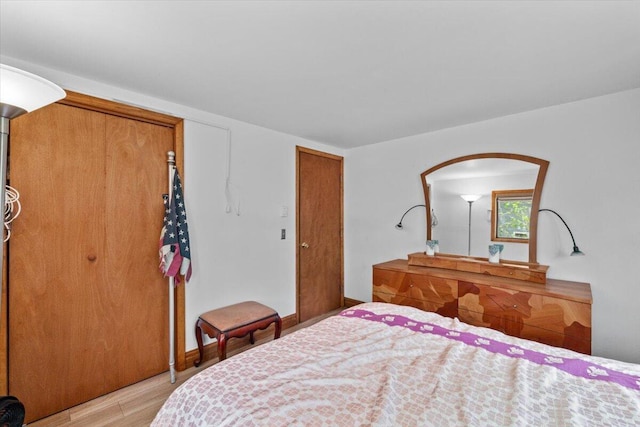 206 Maxatawny Dr, Pocono Lake, PA 18347 - bedroom with light wood-style flooring, arched walkways, and baseboards