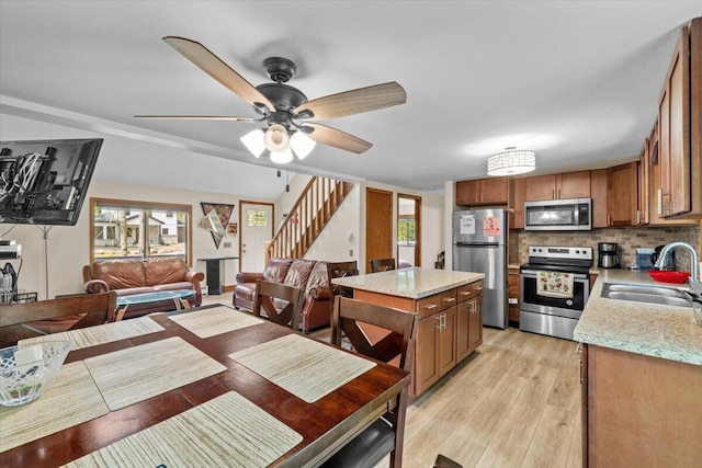206 Maxatawny Dr, Pocono Lake, PA 18347 - dining room featuring stairway, light wood finished floors, and ceiling fan