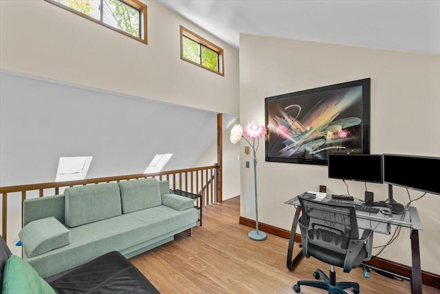206 Maxatawny Dr, Pocono Lake, PA 18347 - home office featuring wood finished floors, lofted ceiling, baseboards, and a skylight