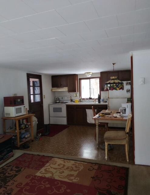 107 Cottonwood Ln, Dingmans Ferry, PA 18328 - kitchen featuring white appliances and under cabinet range hood