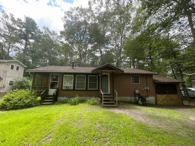 107 Cottonwood Ln, Dingmans Ferry, PA 18328 - view of front of property featuring entry steps and a front lawn