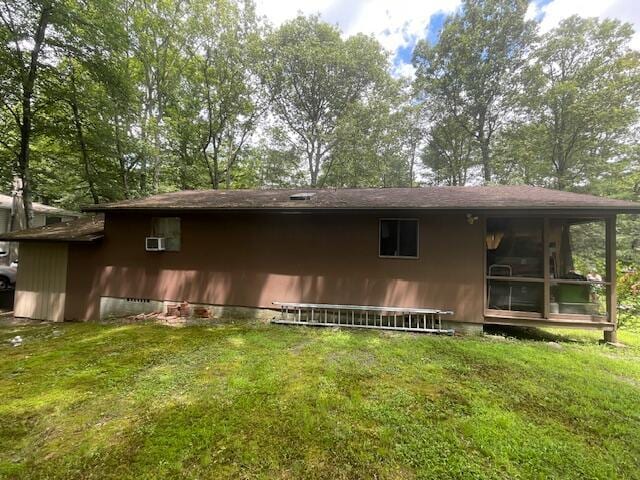 107 Cottonwood Ln, Dingmans Ferry, PA 18328 - back of house featuring a yard and a sunroom