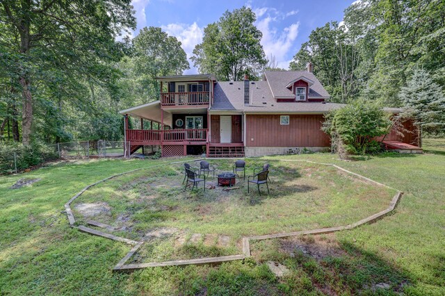 143 Cathleen Dr, East Stroudsburg, PA 18302 - back of house with an outdoor fire pit, a deck, a chimney, and a balcony