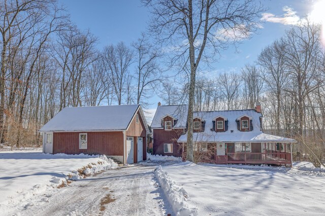 143 Cathleen Dr, East Stroudsburg, PA 18302 - view of front of home featuring a chimney, an outdoor structure, and a garage