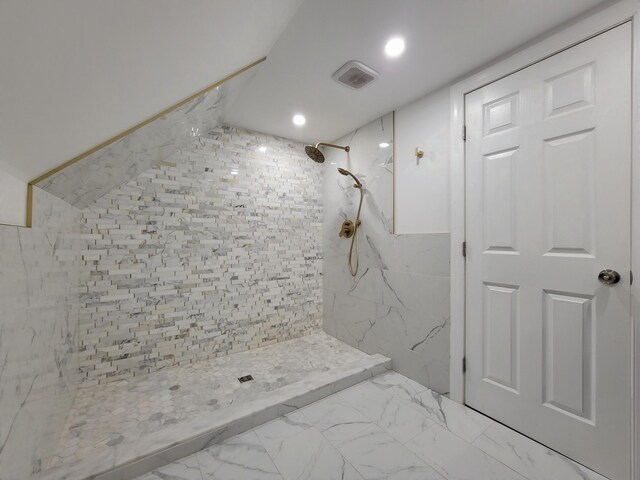 143 Cathleen Dr, East Stroudsburg, PA 18302 - full bathroom featuring a tile shower, recessed lighting, marble finish floors, and tile walls