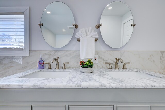 143 Cathleen Dr, East Stroudsburg, PA 18302 - full bathroom with double vanity and backsplash